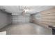 Spacious garage features a gray epoxy floor, block walls, and shelving at 411 Meadowood Blvd, Fern Park, FL 32730