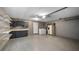 Spacious garage with epoxy floor, utility sink, washer, dryer, and ample storage space at 411 Meadowood Blvd, Fern Park, FL 32730