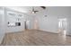 Open concept living space featuring a breakfast bar, vaulted ceilings, and seamless flow at 411 Meadowood Blvd, Fern Park, FL 32730