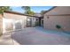 An open-air patio surrounded by neutral walls and complemented by a white lattice fence, for a private outdoor space at 411 Meadowood Blvd, Fern Park, FL 32730