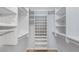 Custom walk-in closet with organized shelving and ample storage space at 411 Meadowood Blvd, Fern Park, FL 32730