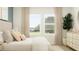 Stylish bedroom with a large window, dresser, and plant offers comfortable and bright living at 4343 Curacao Pl, Kissimmee, FL 34758