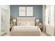 Comfortable bedroom with large bed, artwork, and windows provides a serene and inviting space at 4343 Curacao Pl, Kissimmee, FL 34758