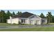 Charming single-story home featuring a symmetrical facade, two-car garage, and beautifully landscaped front yard at 4343 Curacao Pl, Kissimmee, FL 34758