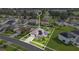 Aerial view showcases this home with solar panels, a green lawn, and neighborhood views at 5203 Jasmine Trace Ln, Kissimmee, FL 34758
