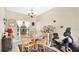 Cozy dining room featuring a charming table set and ample natural light at 5203 Jasmine Trace Ln, Kissimmee, FL 34758