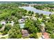 Aerial view of neighborhood featuring mature trees, a lake and well maintained properties at 556 Lake Ave, Altamonte Springs, FL 32701