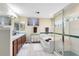 Bright bathroom with double vanity, soaking tub, and glass-enclosed shower at 556 Lake Ave, Altamonte Springs, FL 32701