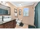 Well-lit bathroom featuring a modern sink, granite countertop, and stylish fixtures at 556 Lake Ave, Altamonte Springs, FL 32701