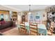 Bright dining area with access to the backyard and views of the cozy living room with a fireplace at 556 Lake Ave, Altamonte Springs, FL 32701