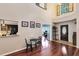 Inviting entryway featuring hardwood floors, natural light, and a view into the kitchen and office at 556 Lake Ave, Altamonte Springs, FL 32701