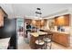 Beautiful kitchen showcasing granite countertops, an island with seating, and views of the office space at 556 Lake Ave, Altamonte Springs, FL 32701