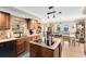 Modern kitchen with granite counters, an island cooktop, and views of the dining area and living room at 556 Lake Ave, Altamonte Springs, FL 32701
