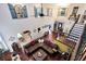 Open floor plan showcasing hardwood floors, a spacious sectional sofa, and a clear view of the dining and entry area at 556 Lake Ave, Altamonte Springs, FL 32701