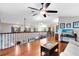 Bright living room with hardwood floors, ceiling fan, and view of the staircase and landing at 556 Lake Ave, Altamonte Springs, FL 32701