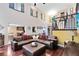 Elegant living room with a high ceiling, hardwood floors, and comfortable seating at 556 Lake Ave, Altamonte Springs, FL 32701