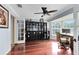 Bright office space with hardwood floors, built-in shelving, and a large window for ample natural light at 556 Lake Ave, Altamonte Springs, FL 32701
