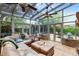 Bright sunroom filled with natural light and a comfortable seating area at 556 Lake Ave, Altamonte Springs, FL 32701