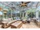 Bright sunroom filled with natural light and a comfortable seating area at 556 Lake Ave, Altamonte Springs, FL 32701
