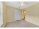 Bedroom featuring neutral carpet, a closet, and access to a bathroom at 6052 Westgate Dr # 204, Orlando, FL 32835