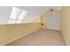 Cozy loft space with neutral carpet and a large skylight at 6052 Westgate Dr # 204, Orlando, FL 32835