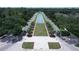 Stunning aerial view of the community with a water feature and lush landscaping along the avenue at 6333 Schoolhouse Pond Rd, Winter Garden, FL 34787