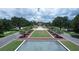 Beautiful aerial view of clock tower and green spaces in the community, showcasing the well-maintained landscaping at 6333 Schoolhouse Pond Rd, Winter Garden, FL 34787