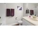 Bright bathroom features a single sink vanity with a mirror and shower-tub combination at 6333 Schoolhouse Pond Rd, Winter Garden, FL 34787