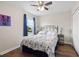 Comfortable bedroom features a ceiling fan, closet, and a window with curtains at 6333 Schoolhouse Pond Rd, Winter Garden, FL 34787
