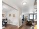 Inviting living room featuring wood floors, modern lighting, and comfortable seating area at 6333 Schoolhouse Pond Rd, Winter Garden, FL 34787