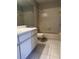 Bathroom with tiled shower/tub, a large mirror, a white vanity, and tiled floors at 652 Roaring Dr # 234, Altamonte Springs, FL 32714