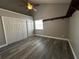 Bedroom with gray walls, hard wood floors and walk in closet at 652 Roaring Dr # 234, Altamonte Springs, FL 32714