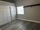 Bedroom with gray walls, hard wood floors and walk in closet at 652 Roaring Dr # 234, Altamonte Springs, FL 32714