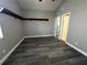 This bedroom features new gray paint, modern floors, and a small corner shelf at 652 Roaring Dr # 234, Altamonte Springs, FL 32714