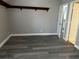This bedroom features new gray paint, modern floors, and a small corner shelf at 652 Roaring Dr # 234, Altamonte Springs, FL 32714