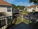 View from the balcony of the community with lush landscaping and reserved parking spots at 652 Roaring Dr # 234, Altamonte Springs, FL 32714