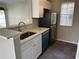 Kitchen with a new stainless steel refrigerator, sink and countertop at 652 Roaring Dr # 234, Altamonte Springs, FL 32714