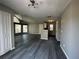 Open-concept living area features updated floors, lots of natural light, ceiling fans, and gray paint at 652 Roaring Dr # 234, Altamonte Springs, FL 32714
