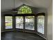 Bright living room featuring a ceiling fan, large windows, grey walls, and wood-look flooring at 652 Roaring Dr # 234, Altamonte Springs, FL 32714