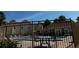 Community pool area featuring multiple chairs and tables, as well as views of the neighboring buildings at 652 Roaring Dr # 234, Altamonte Springs, FL 32714