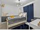 Cozy bedroom features a comfortable bed, stylish decor, and ample natural light at 703 Sunridge Woods Blvd, Davenport, FL 33837