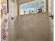 The renovated shower offers decorative tile, a glass block window, and updated fixtures at 703 Sunridge Woods Blvd, Davenport, FL 33837