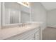 Well-lit bathroom showing the granite-topped vanity, mirror, and neutral color scheme at 7521 Bay Port Rd # 12, Orlando, FL 32819
