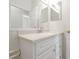 Clean bathroom showcasing a single sink vanity with decorative pulls at 7521 Bay Port Rd # 12, Orlando, FL 32819