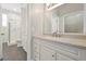 Bright bathroom featuring a granite-topped vanity and a glass-enclosed shower for a modern feel at 7521 Bay Port Rd # 12, Orlando, FL 32819