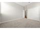 Spacious bedroom featuring neutral carpeting and a double door closet at 7521 Bay Port Rd # 12, Orlando, FL 32819