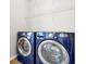 Laundry room featuring a blue front-loading washer and dryer at 7521 Bay Port Rd # 12, Orlando, FL 32819