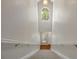Grand staircase featuring a large arched window, enhancing natural light at 7521 Bay Port Rd # 12, Orlando, FL 32819