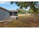 Spacious backyard featuring a screened-in porch, perfect for outdoor relaxation and entertaining at 8 Lake Jackson Dr, Mascotte, FL 34753