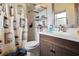Bathroom with vanity, framed mirror, white tile shower, and patterned shower curtain at 8 Lake Jackson Dr, Mascotte, FL 34753
